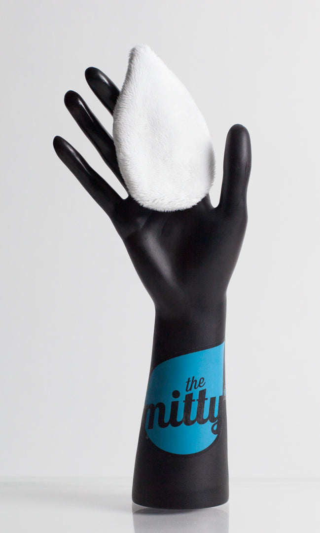 The Mitty Mini in white, on plastic hand